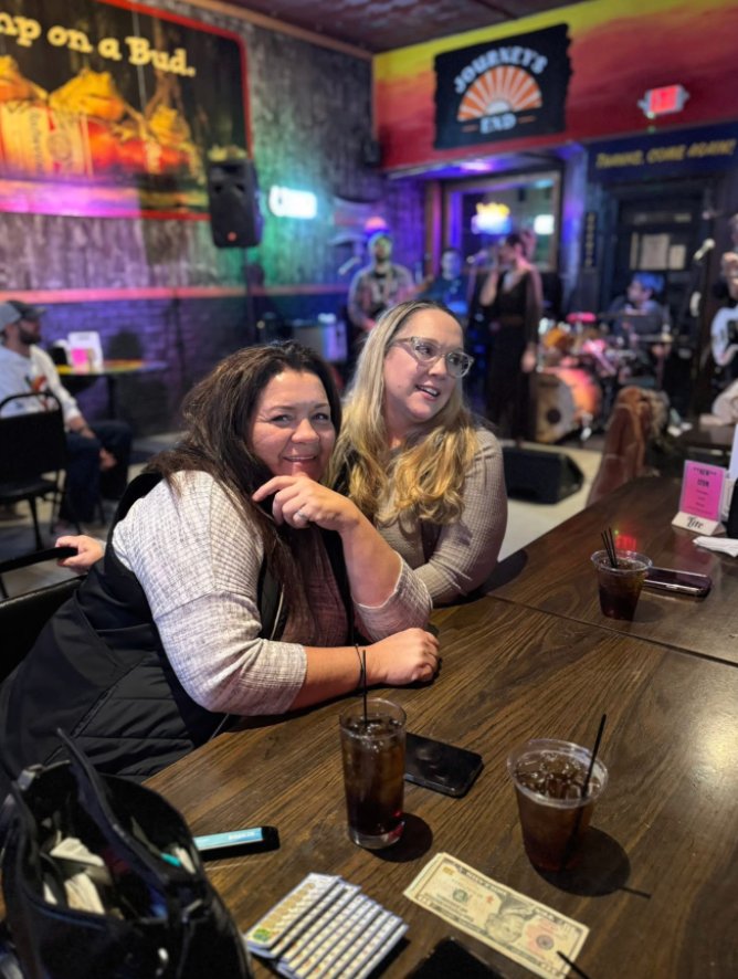 Friends at the bar during live music