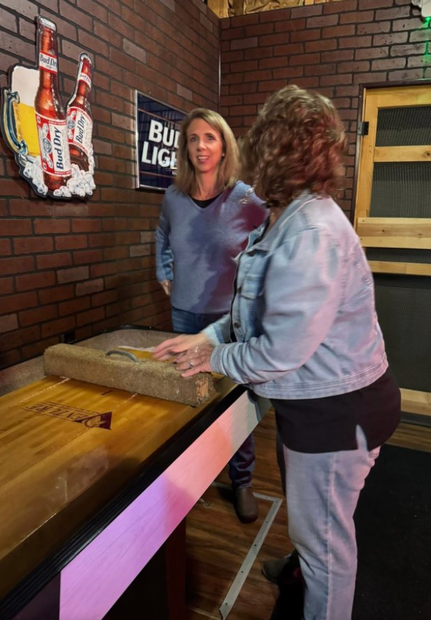 Customers playing shuffleboard